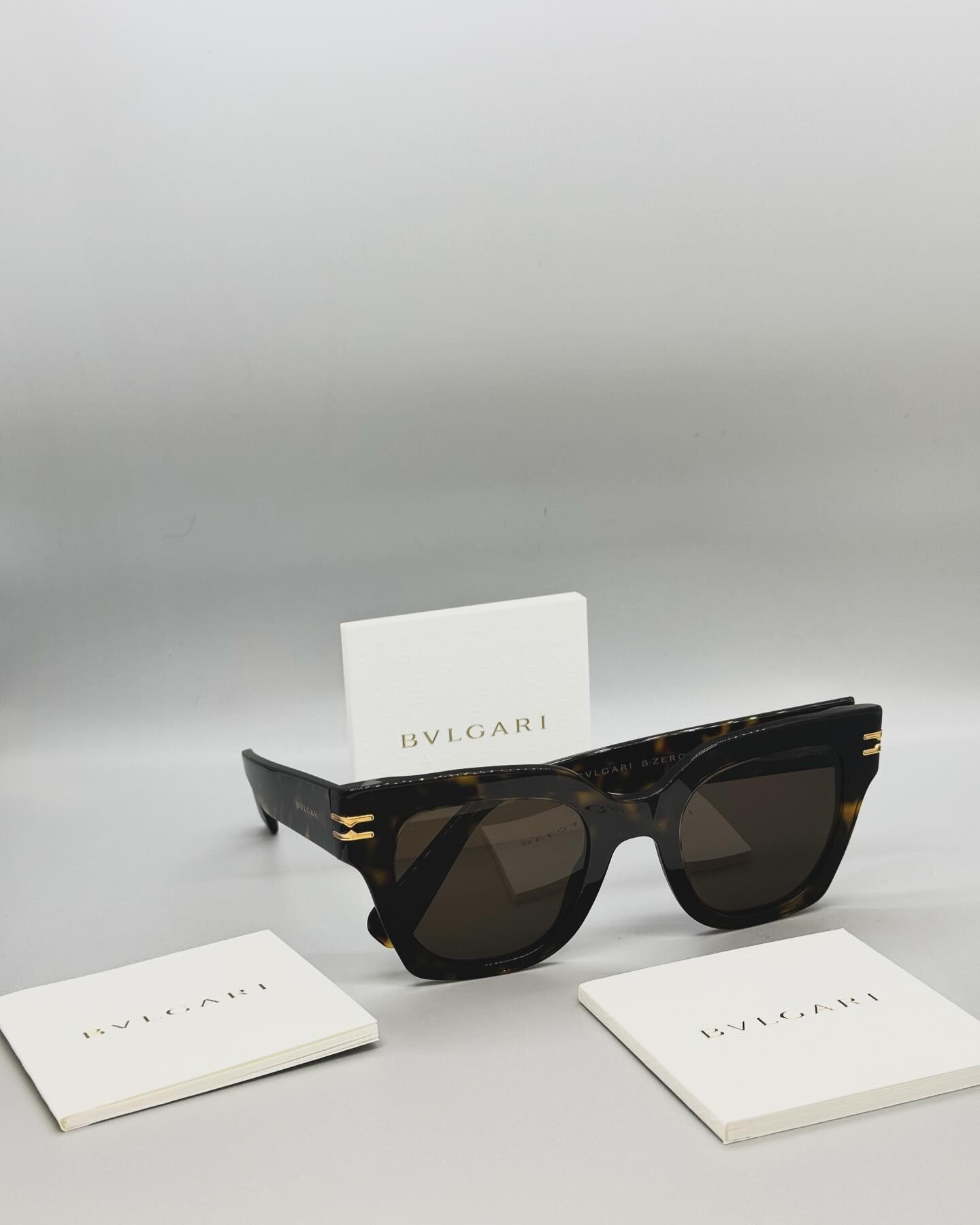 A pair of bvlgari sunglasses sitting on a table