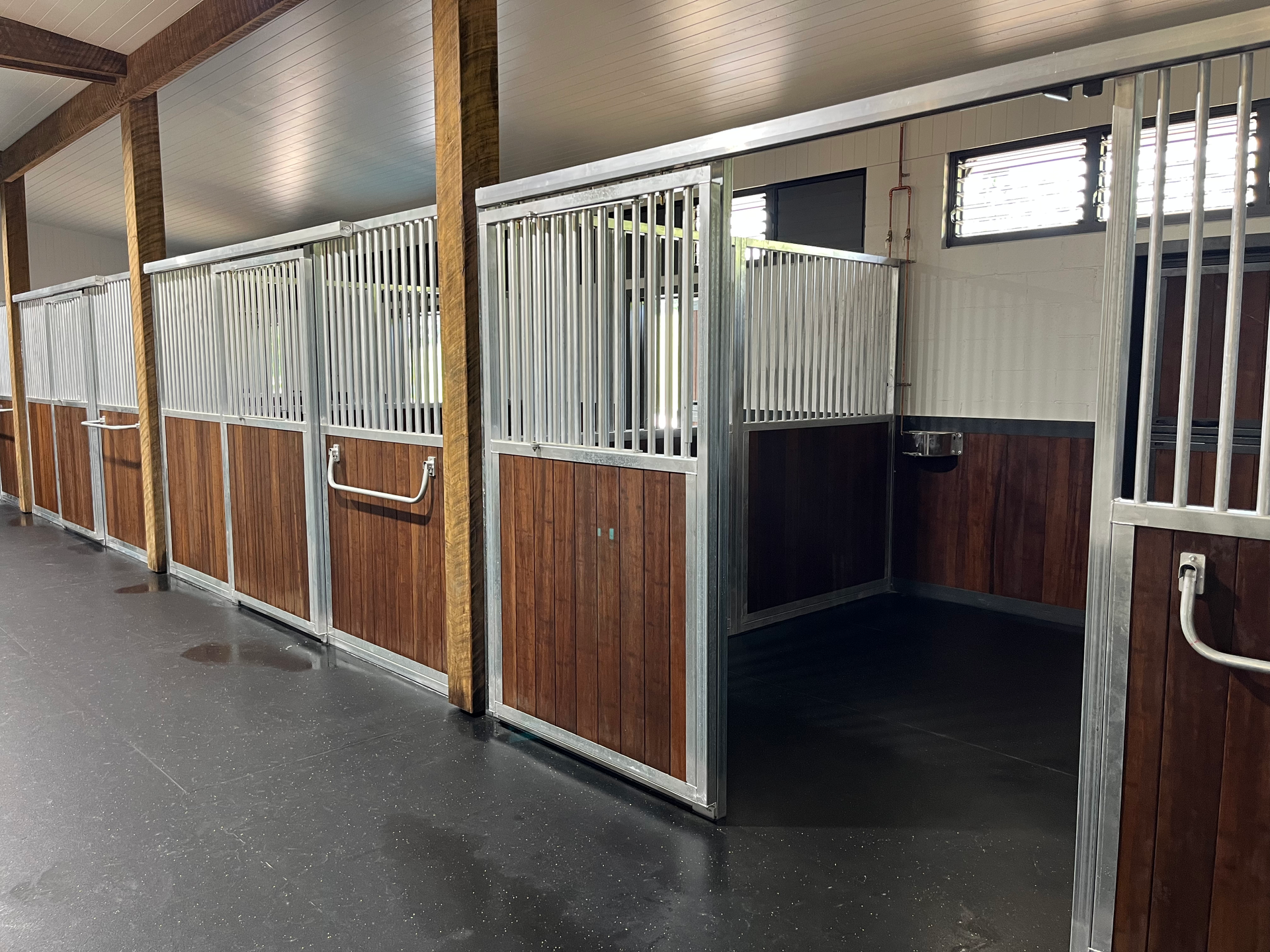 Horse stables with wooden and metal stalls in a barn - Equine Stable Solutions In Diddillibah, QLD