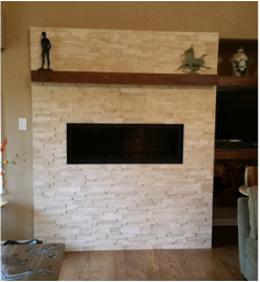 A living room with a fireplace and a television