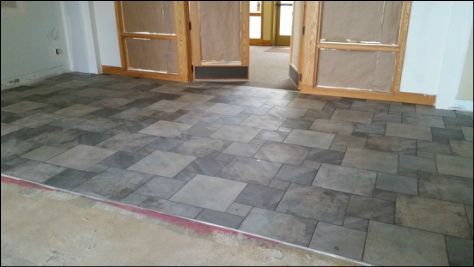 A room with a tiled floor and a doorway