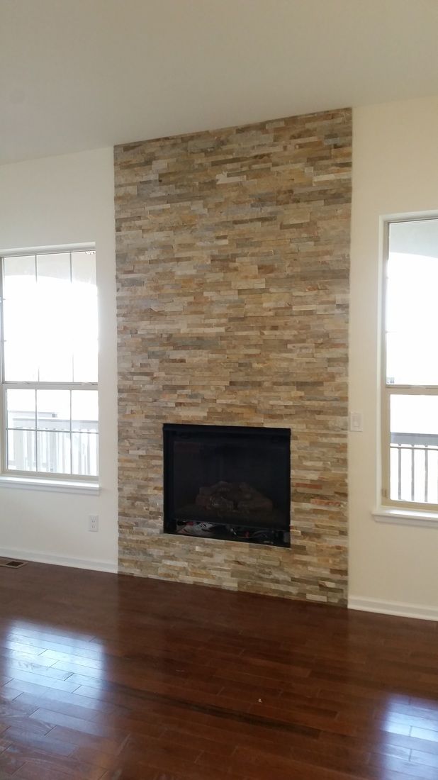 There is a fireplace in the middle of the room.