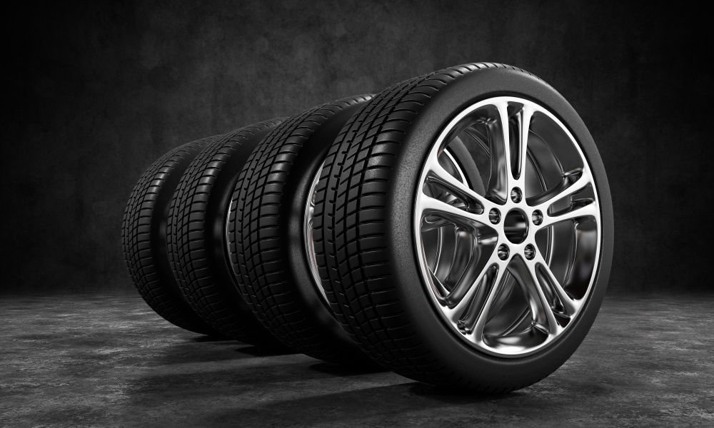 Set Of Tires In Gray Background — Brake Specialists in Molendinar, QLD