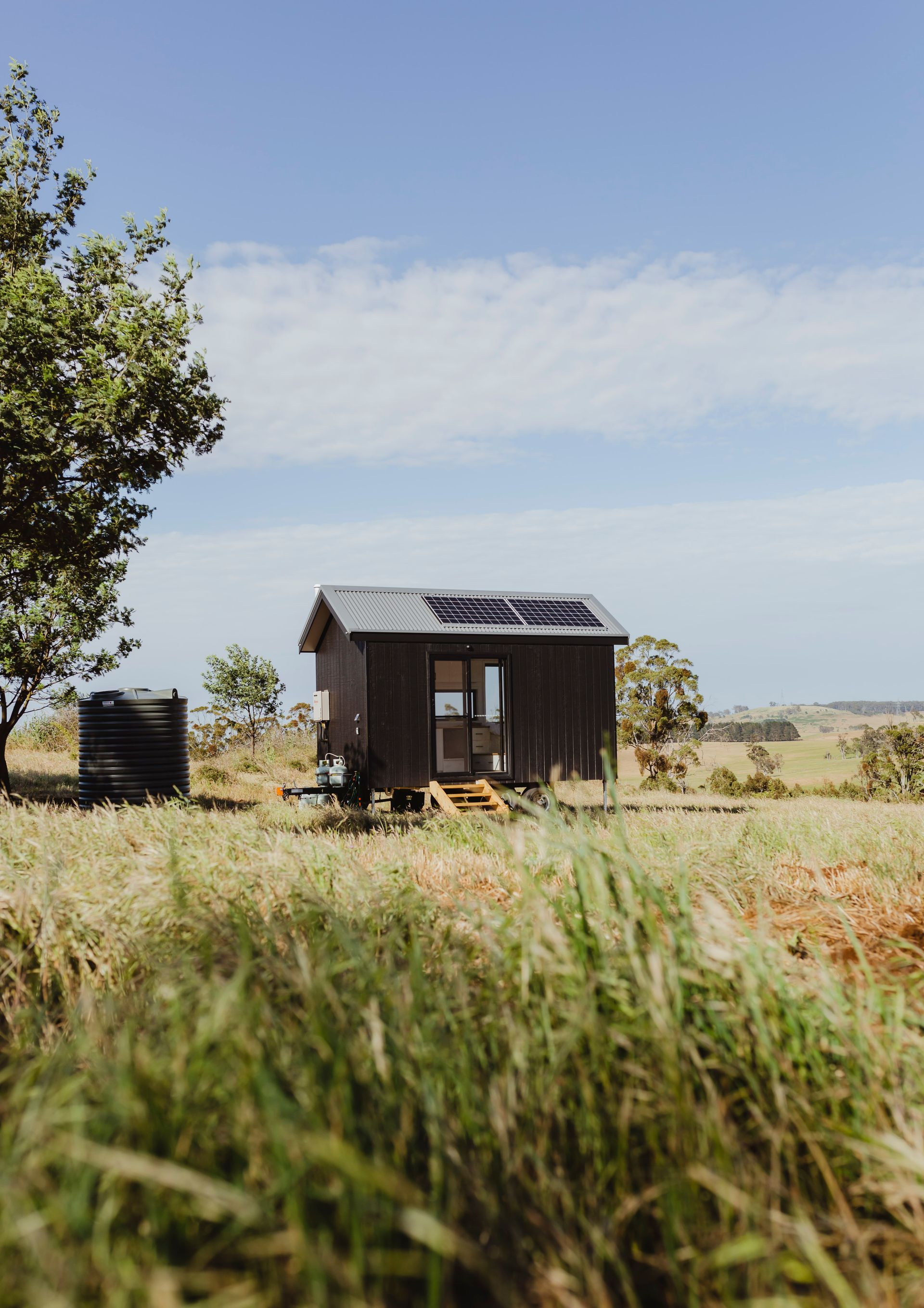 Tiny Dark Cabin With Solar Panels — ASAP Towing Pty Ltd In Tin Can Bay, QLD