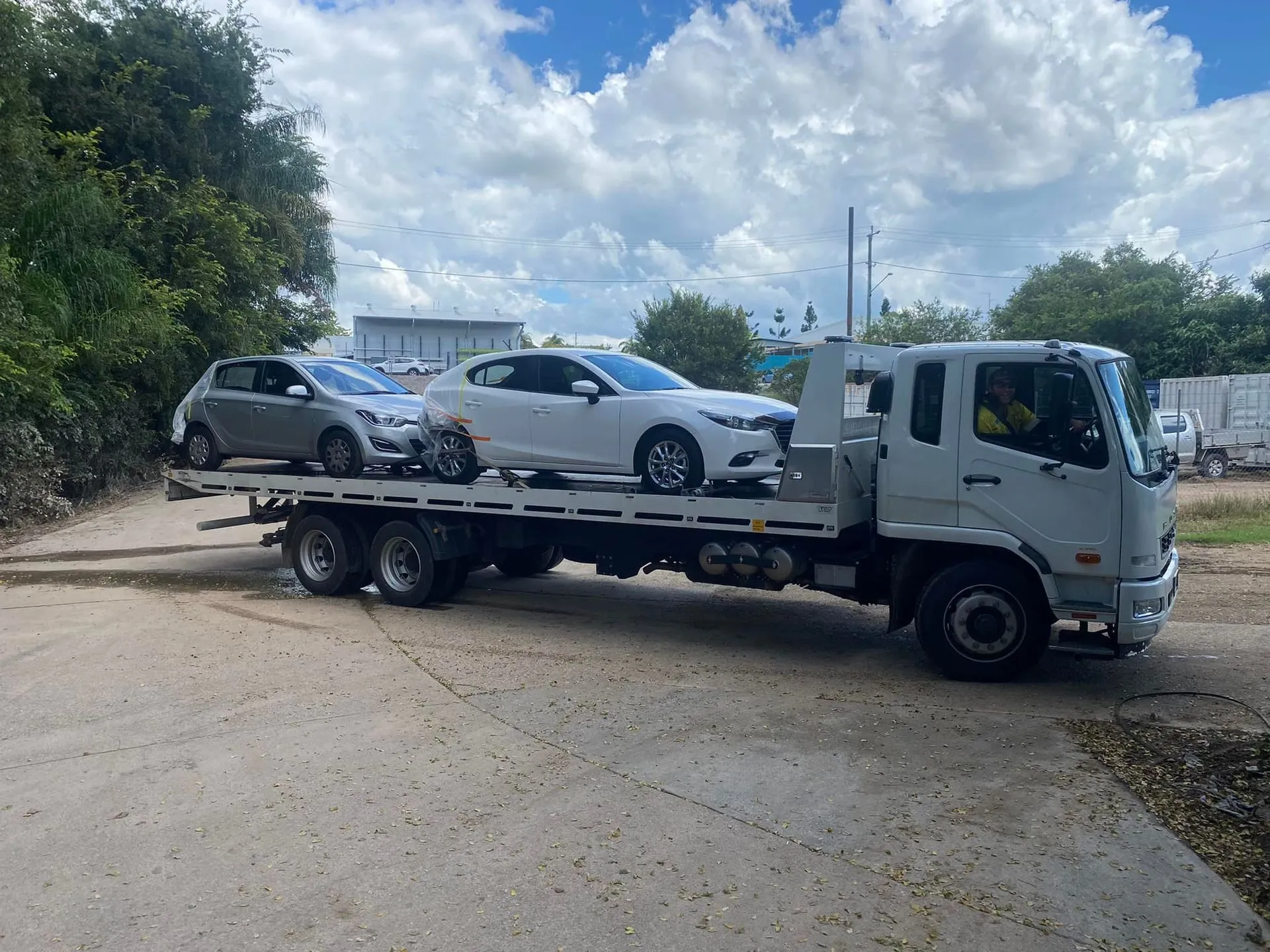 Tow Truck Carrying Two Cars on a Flatbed — ASAP Towing Pty Ltd In Gympie, QLD