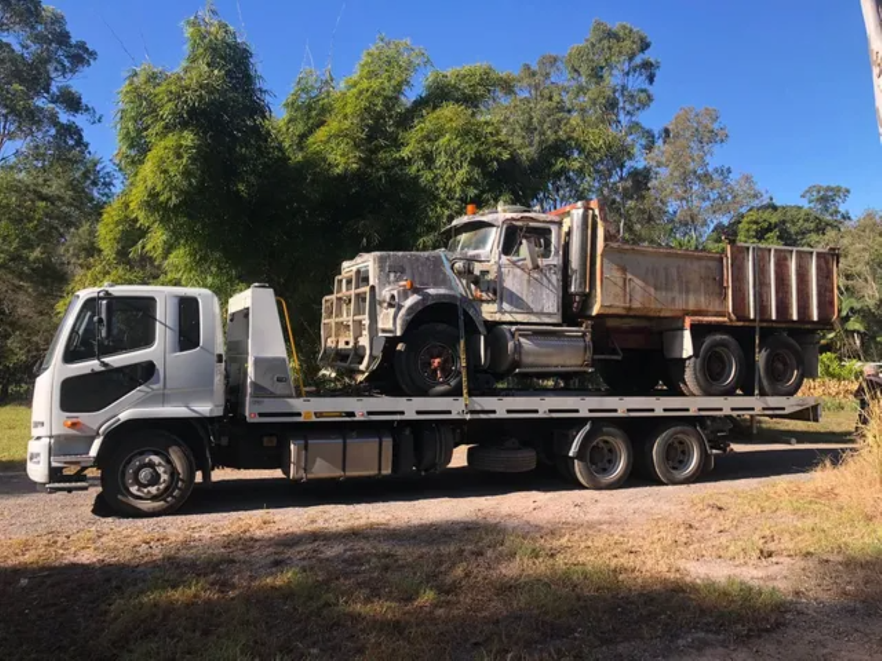 Green Sedan Being Loaded Onto a Yellow Tow Truck — ASAP Towing Pty Ltd In Gympie, QLD