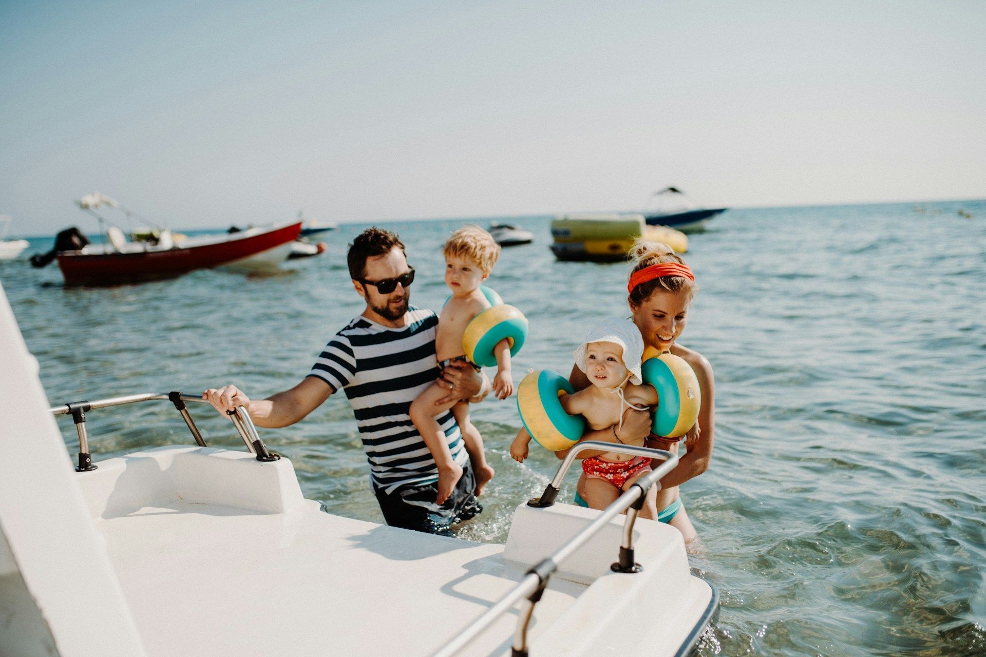 A family is riding a boat in the ocean.