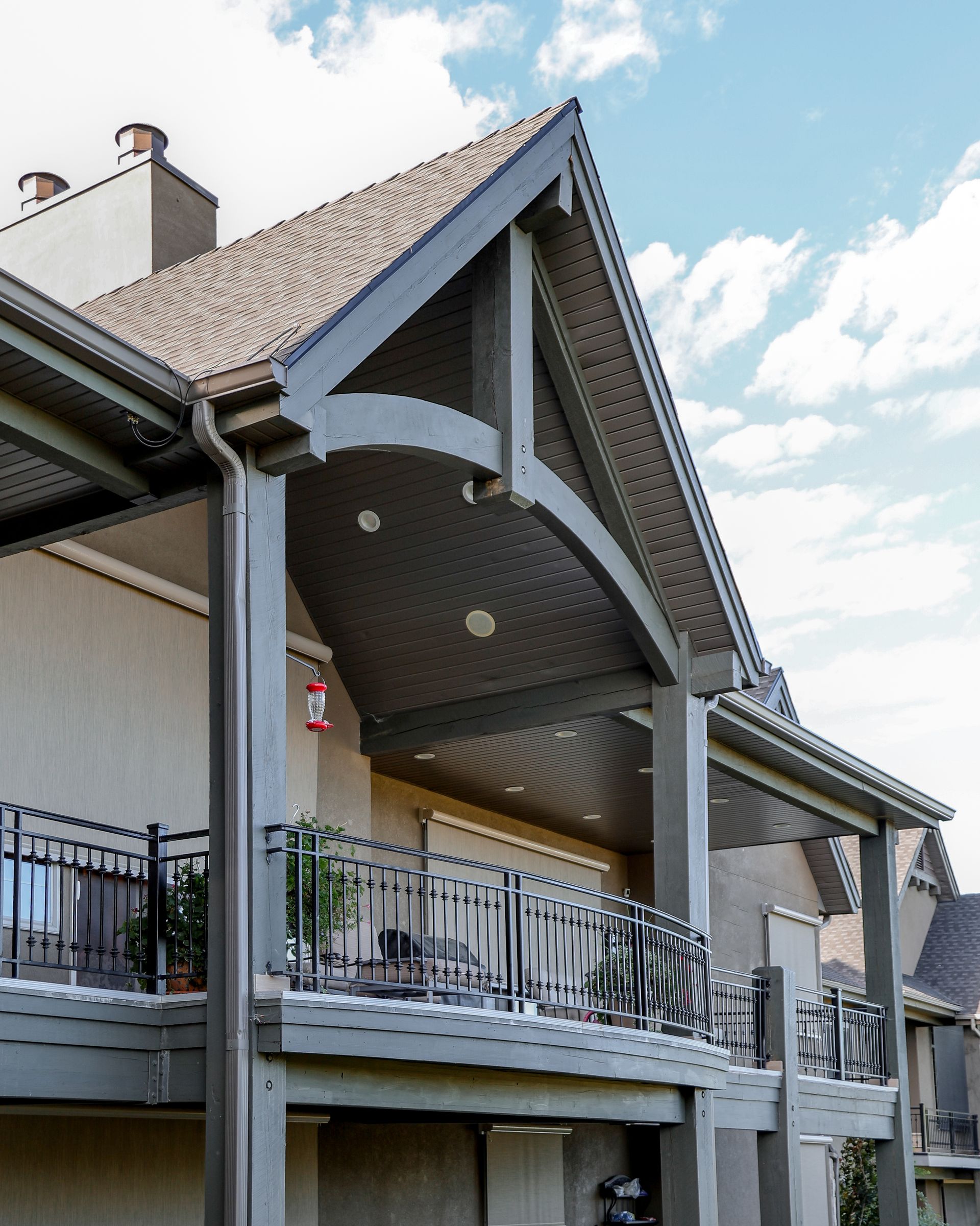 A large house with a balcony and a roof