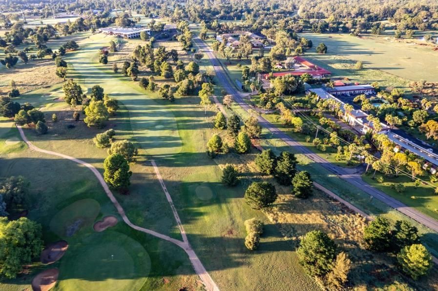 An Aerial View of a Golf Course Surrounded by Trees and Grass — R N R Wrecking N Scrap Car Removal In Beard, ACT
