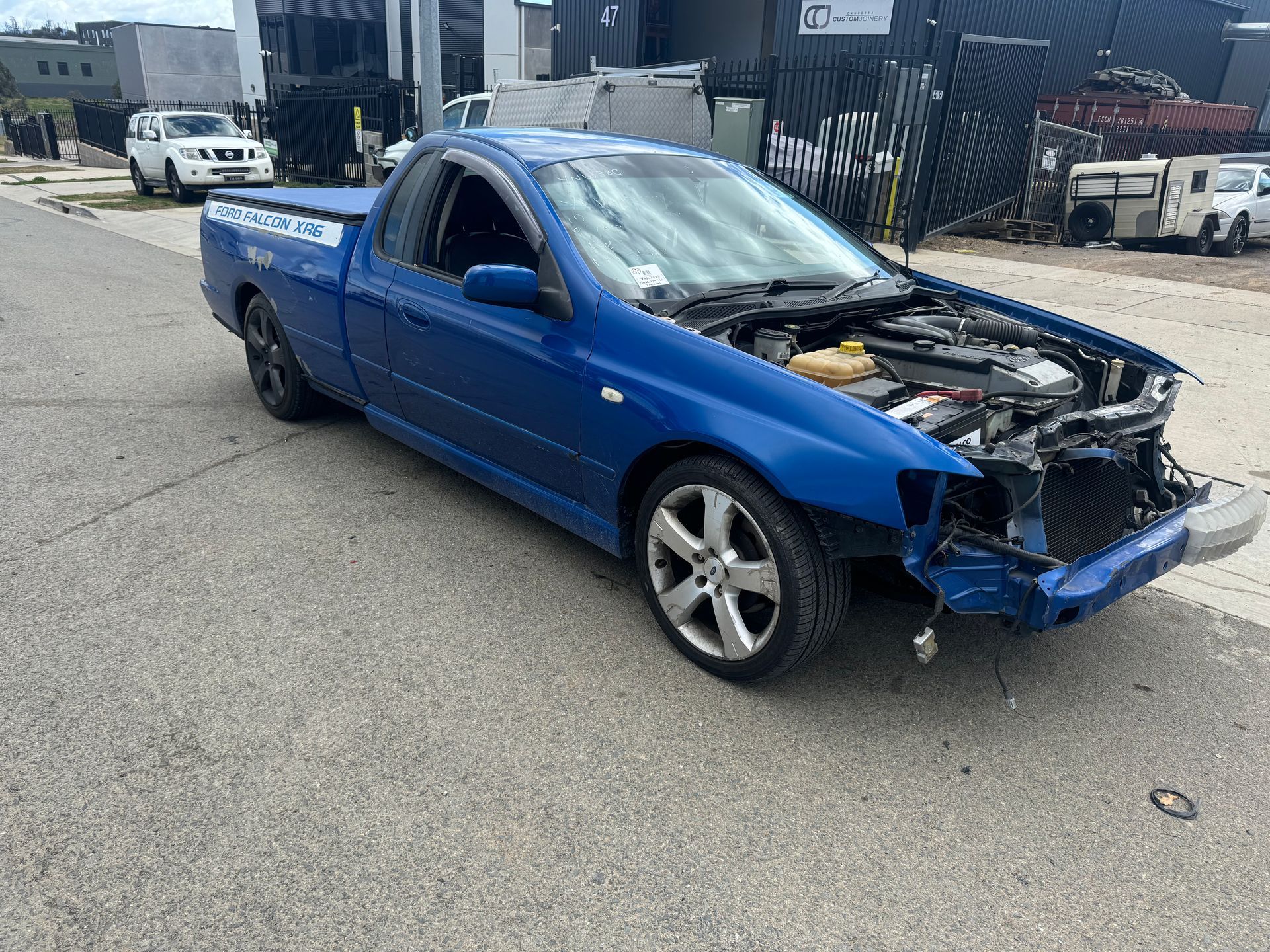 A Blue Pickup Truck With the Hood Up is Parked on the Side of the Road — R N R Wrecking N Scrap Car Removal In Beard, ACT