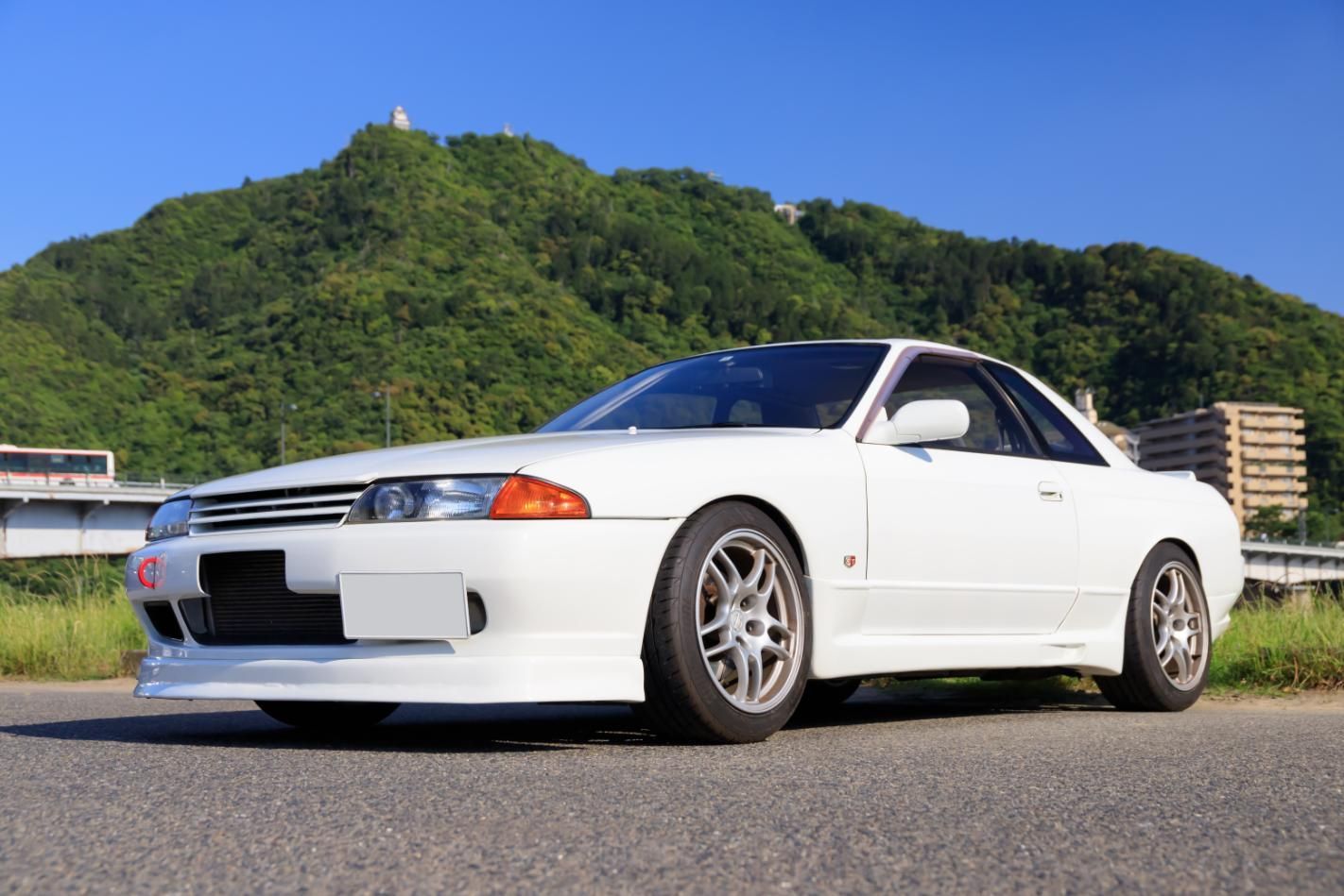 A Red Car Is Parked In A Parking Lot Surrounded By Other Cars — R N R Wrecking N Scrap Car Removal In Queanbeyan, ACT