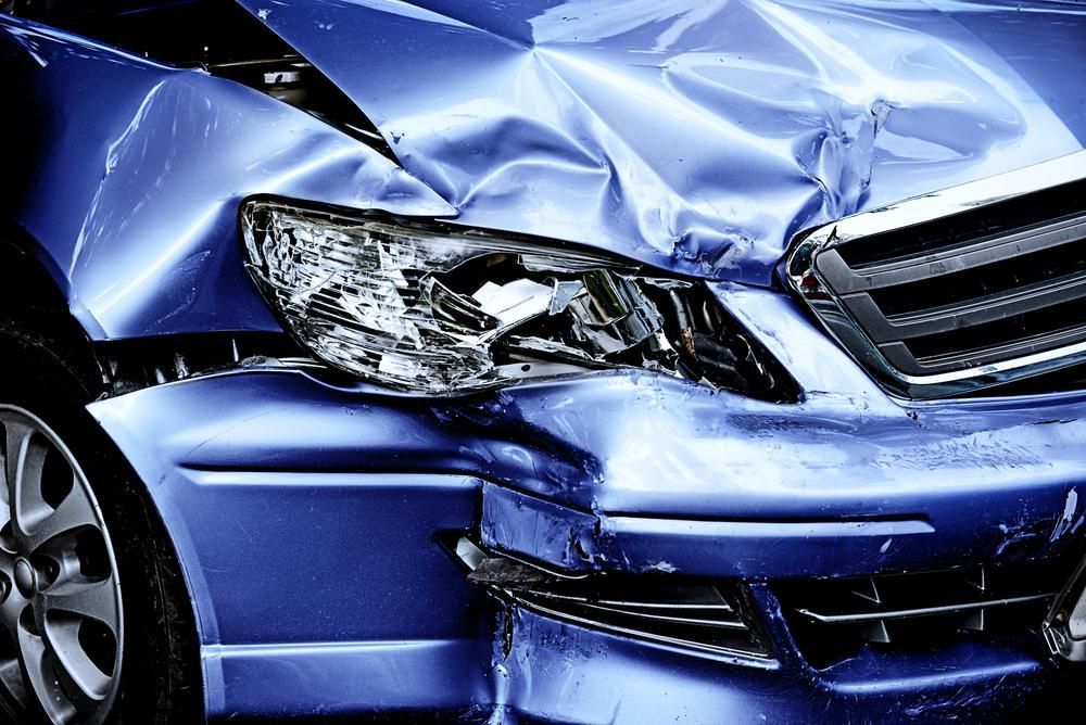 A Blue Car Has Been Damaged in a Car Accident — R N R Wrecking N Scrap Car Removal In Bredbo, ACT
