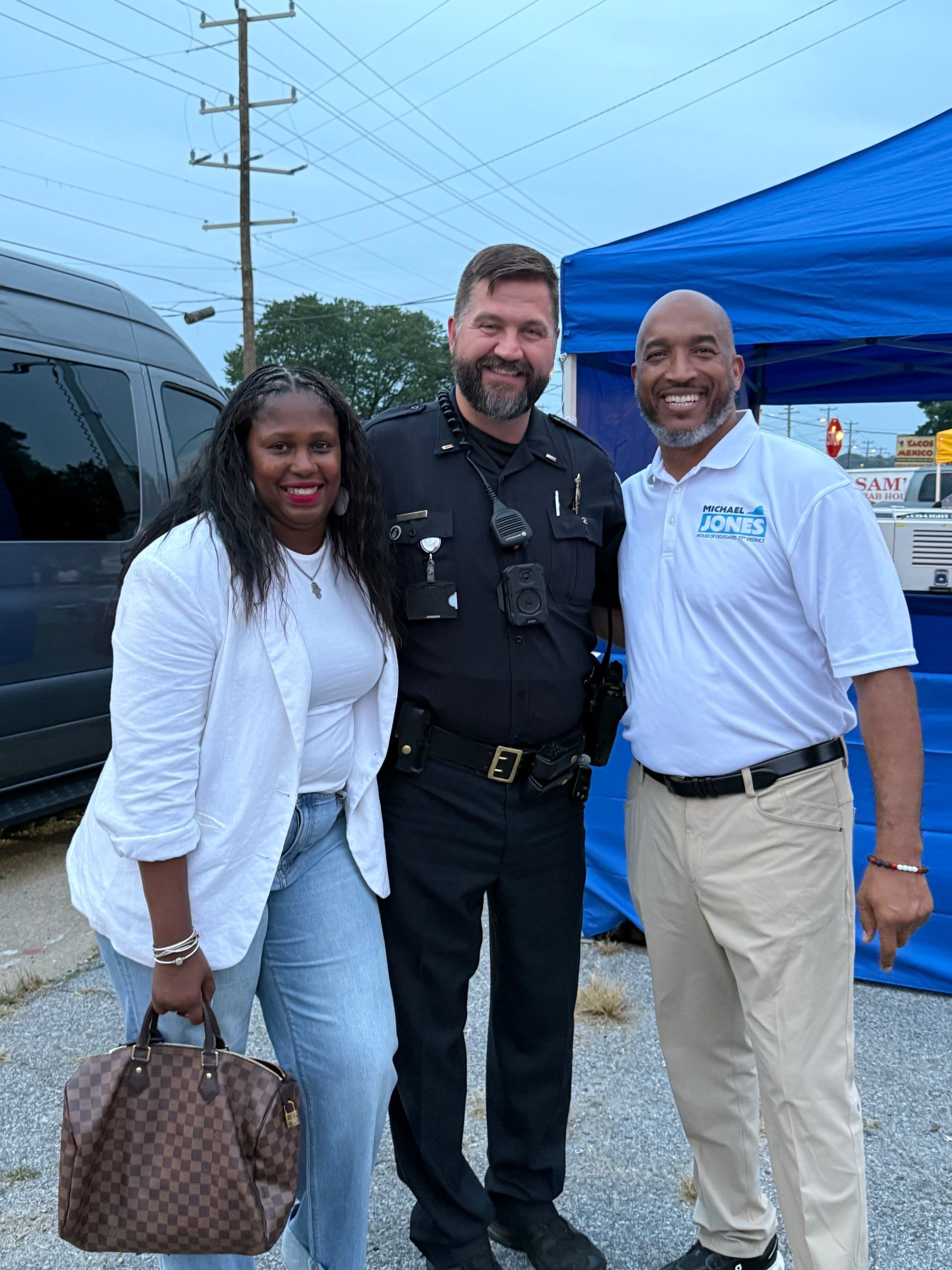 U.S. Capitol Building with white dome and columns, against a blue sky with some clouds.