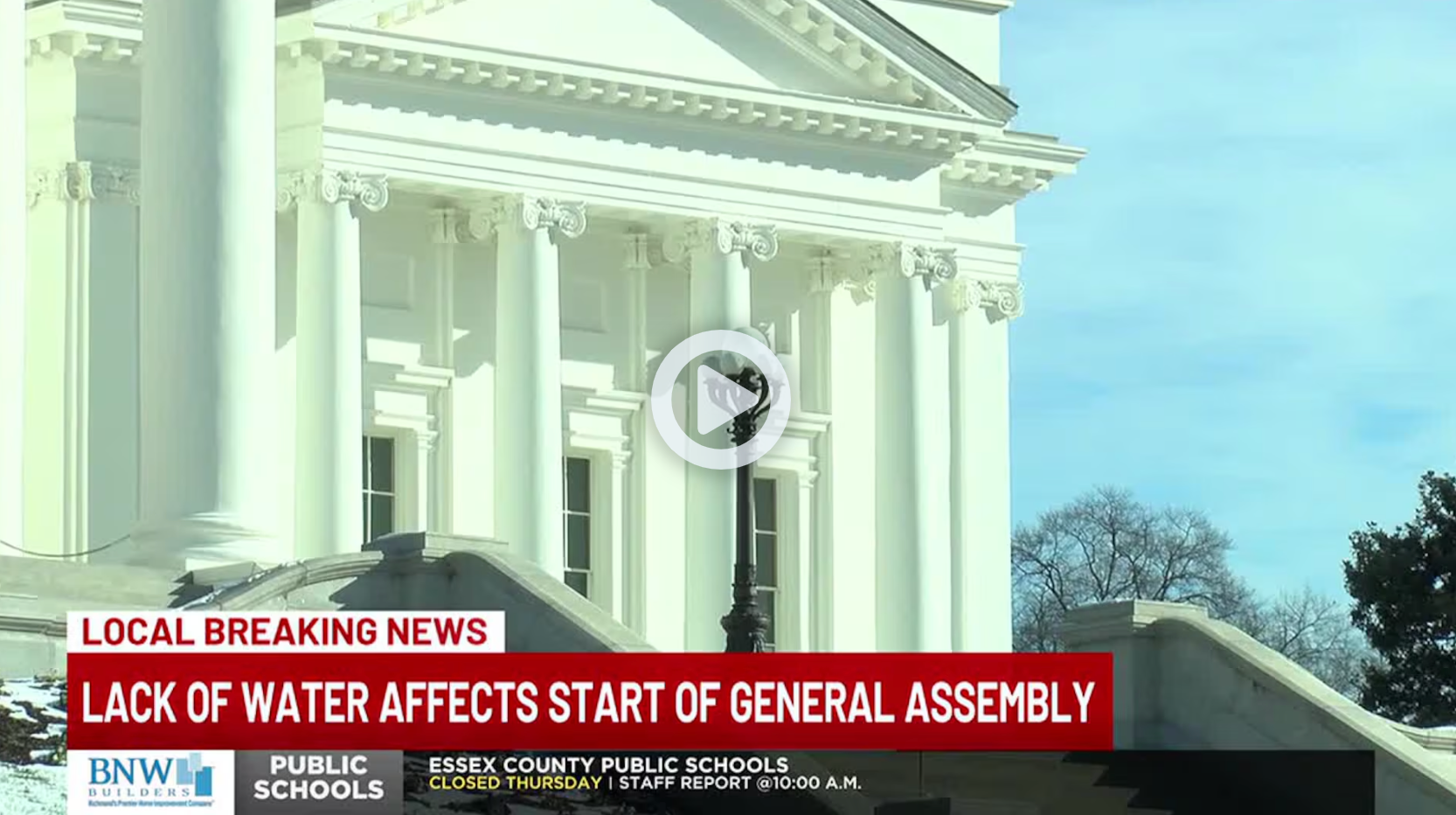 A white building with a red banner that says ' lack of water affects start of general assembly '
