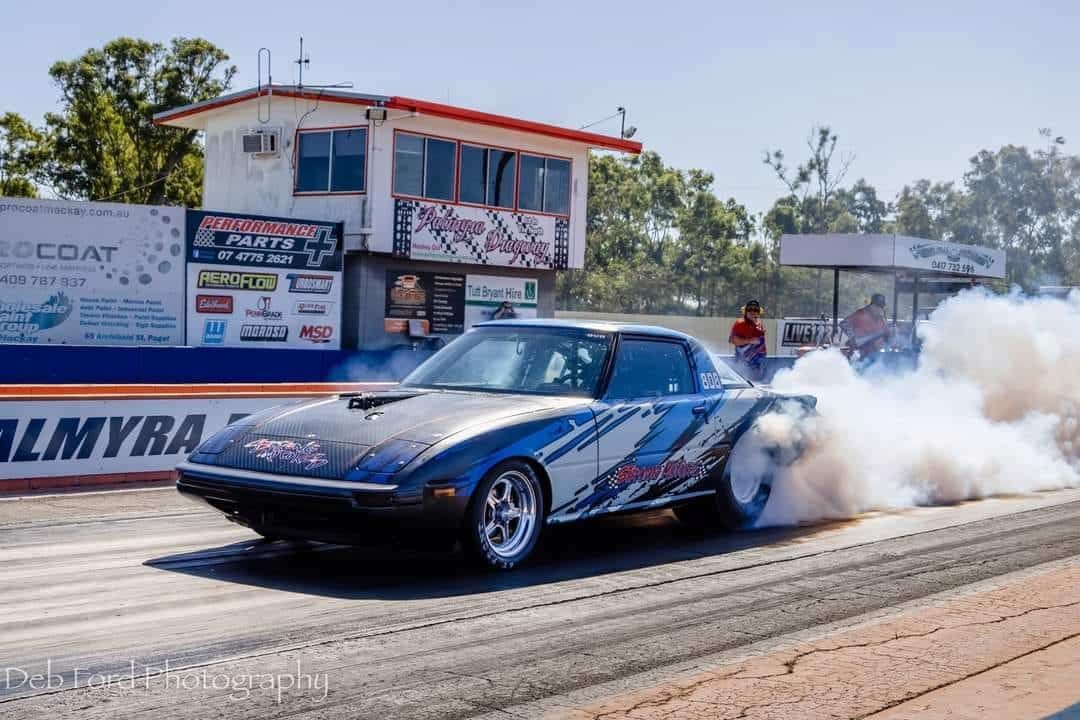 A Car Is Doing A Burnout On A Race Track — Strong Motors In Currajong, QLD