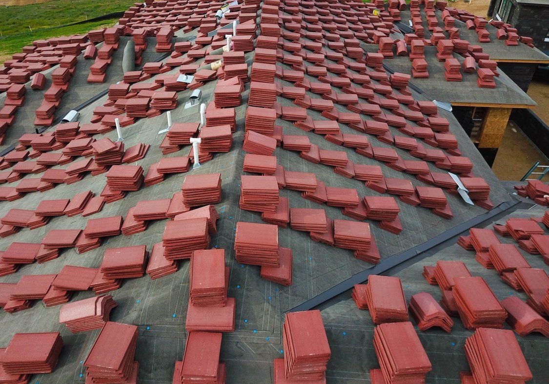 Red tiles on roof for laying Poway