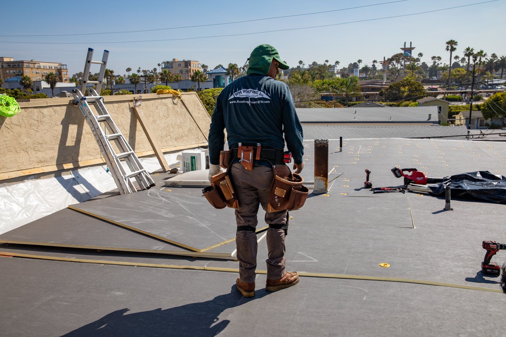 Man working on roof repairs Vista