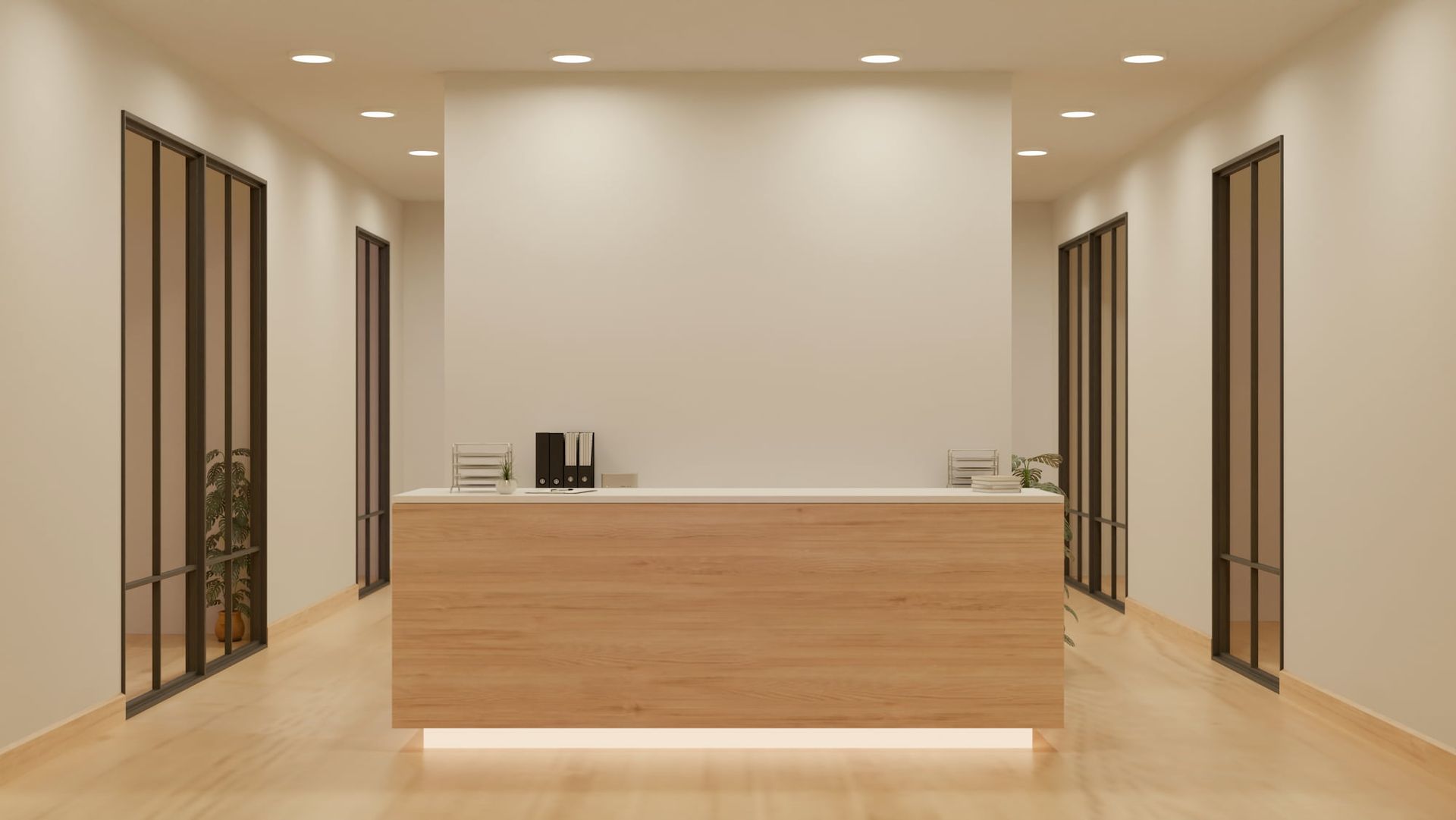 Reception area with a wooden front desk and glass-paneled doors on either side, white walls, and recessed lighting.