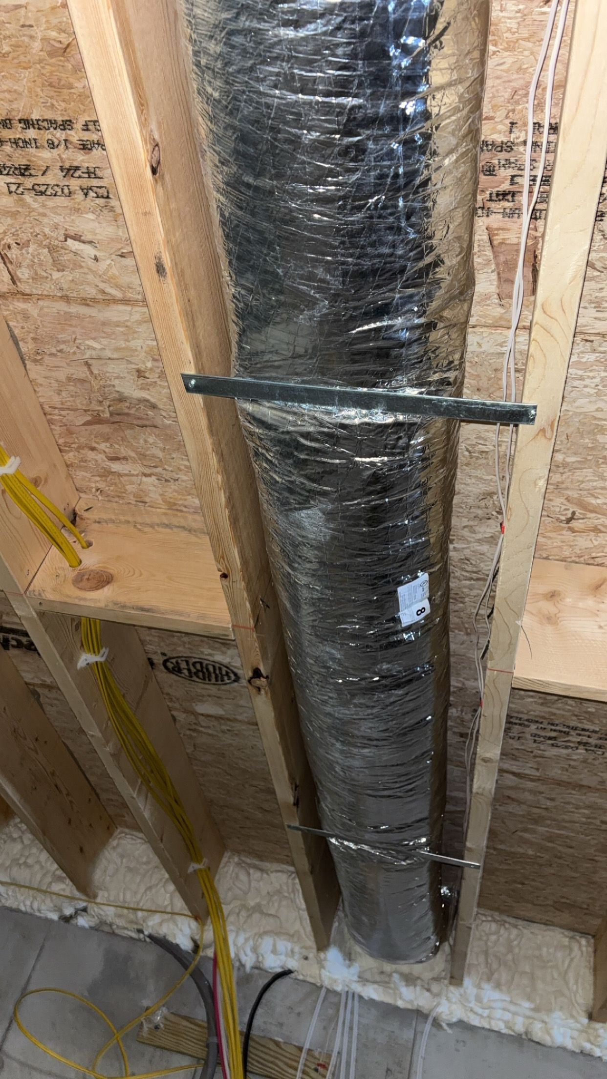 Person in white cap inspecting HVAC ductwork. Person in white cap inspecting HVAC ductwork.