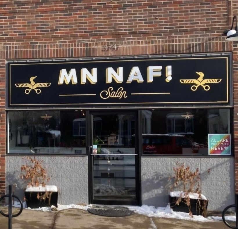 A brick building with a sign that says mn naf