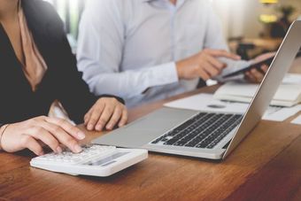 Investment expert calculating the investment return