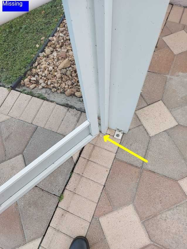 A person is standing next to a white door with a yellow arrow pointing to it