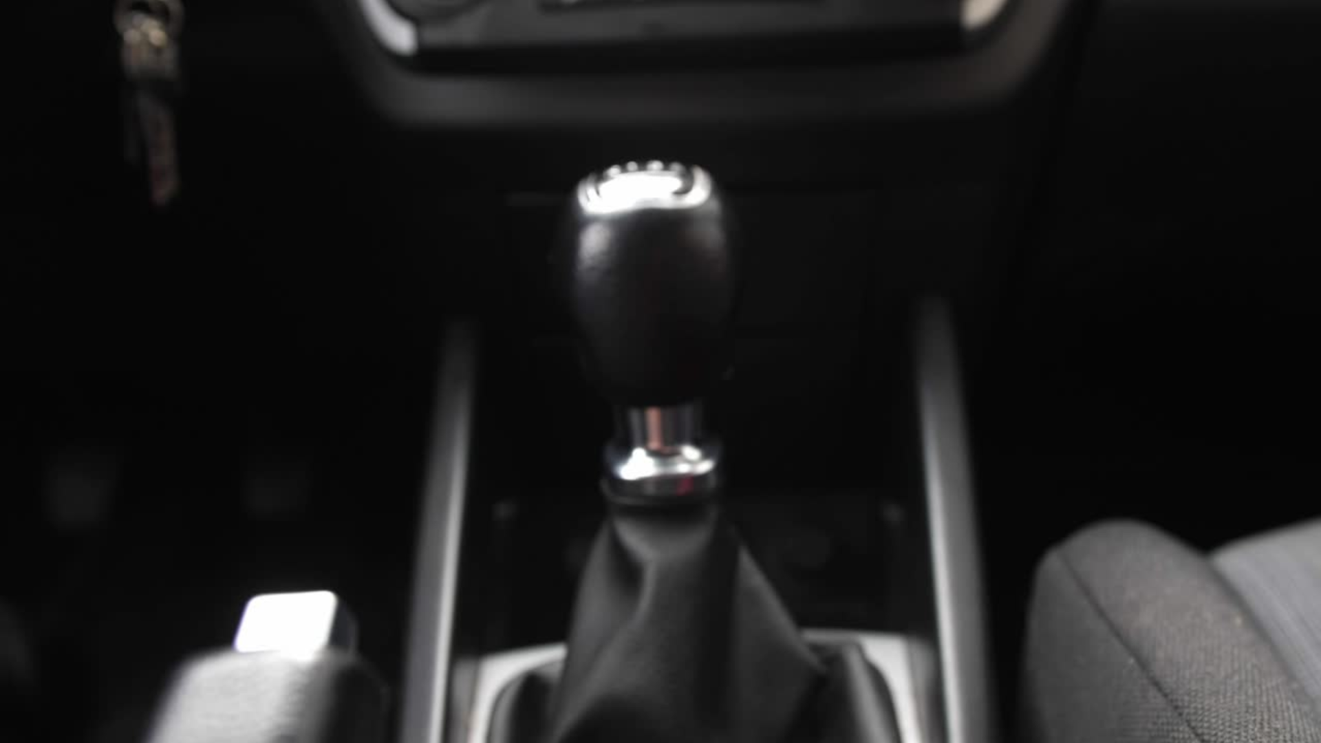 A close up of a shifter in a car.