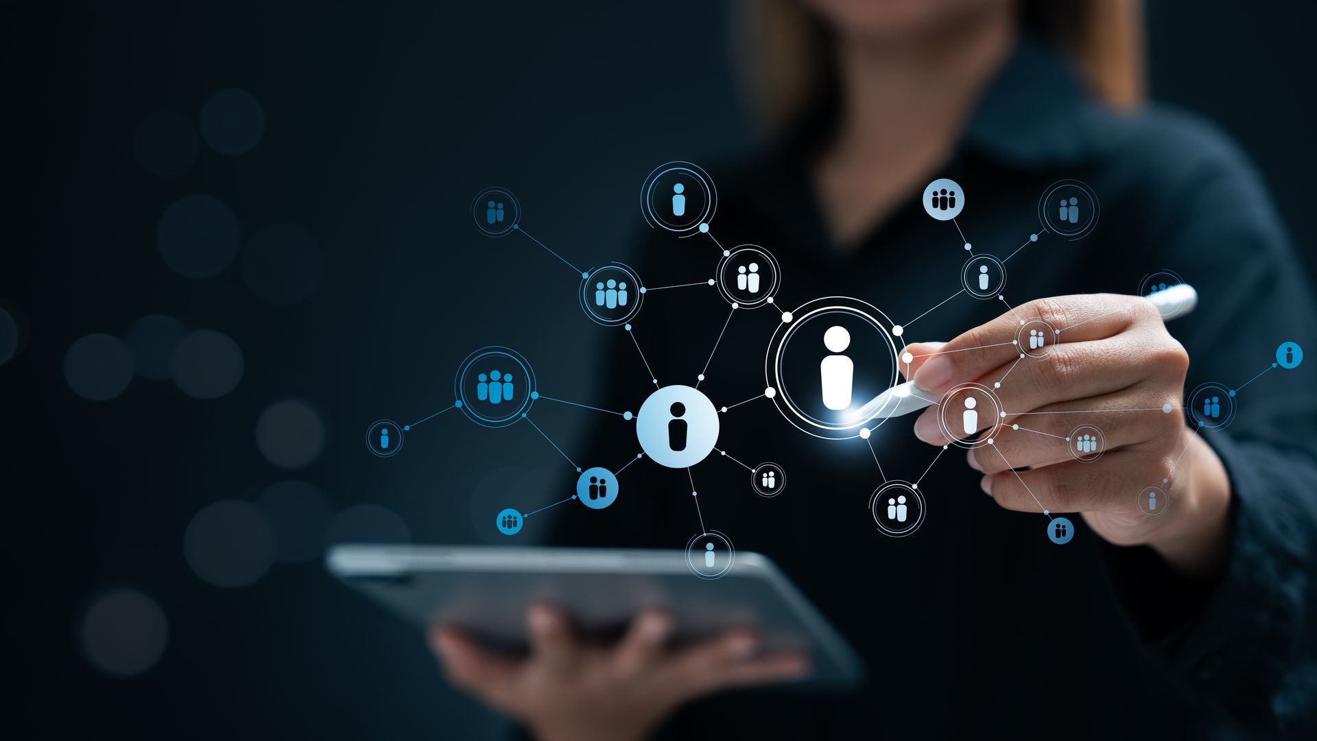 Woman using stylus on tablet, interacting with digital network of icons.