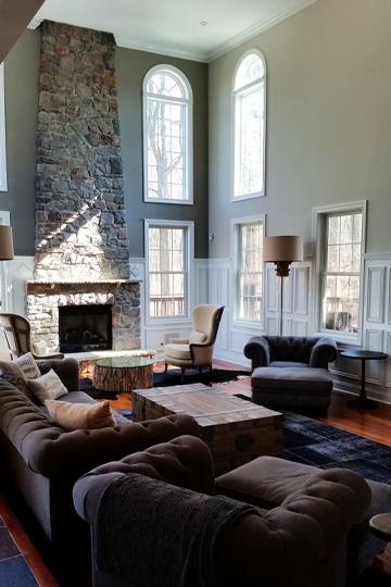 A living room with lots of furniture and a fireplace