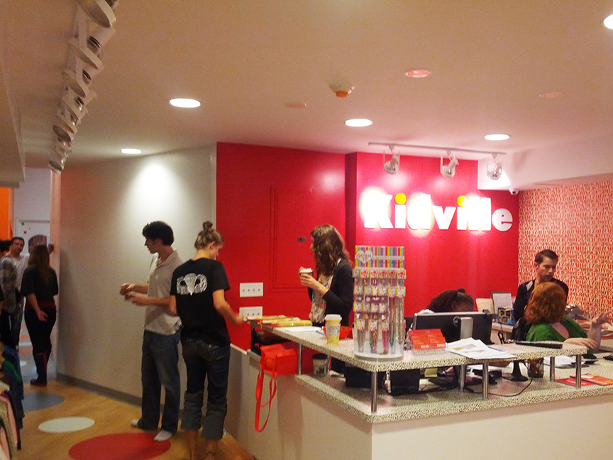 A group of people standing in front of a sign that says cityville