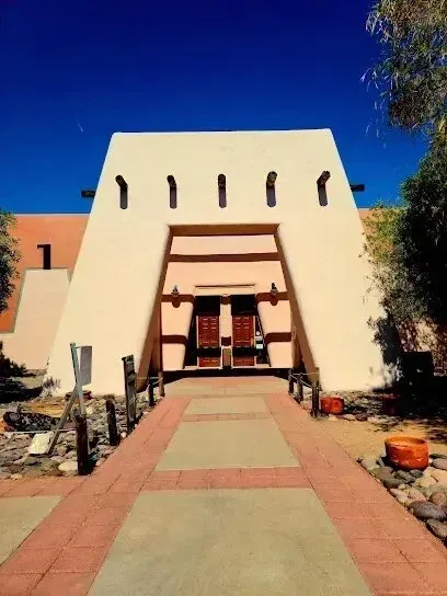 Mobile Detailing-a white building with a red brick walkway leading to it