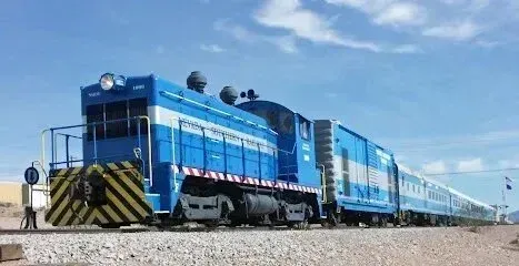 Mobile Detailing-Blue train on tracks against a bright blue sky.