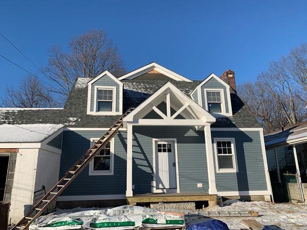 A house with a ladder on the front of it