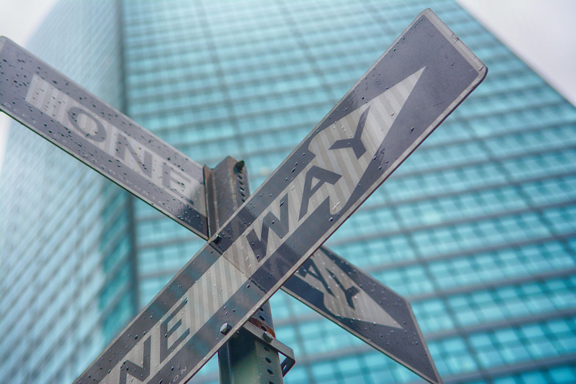 Conflicting one way signs in NYC. Decide which way to go by holding to your core values. 