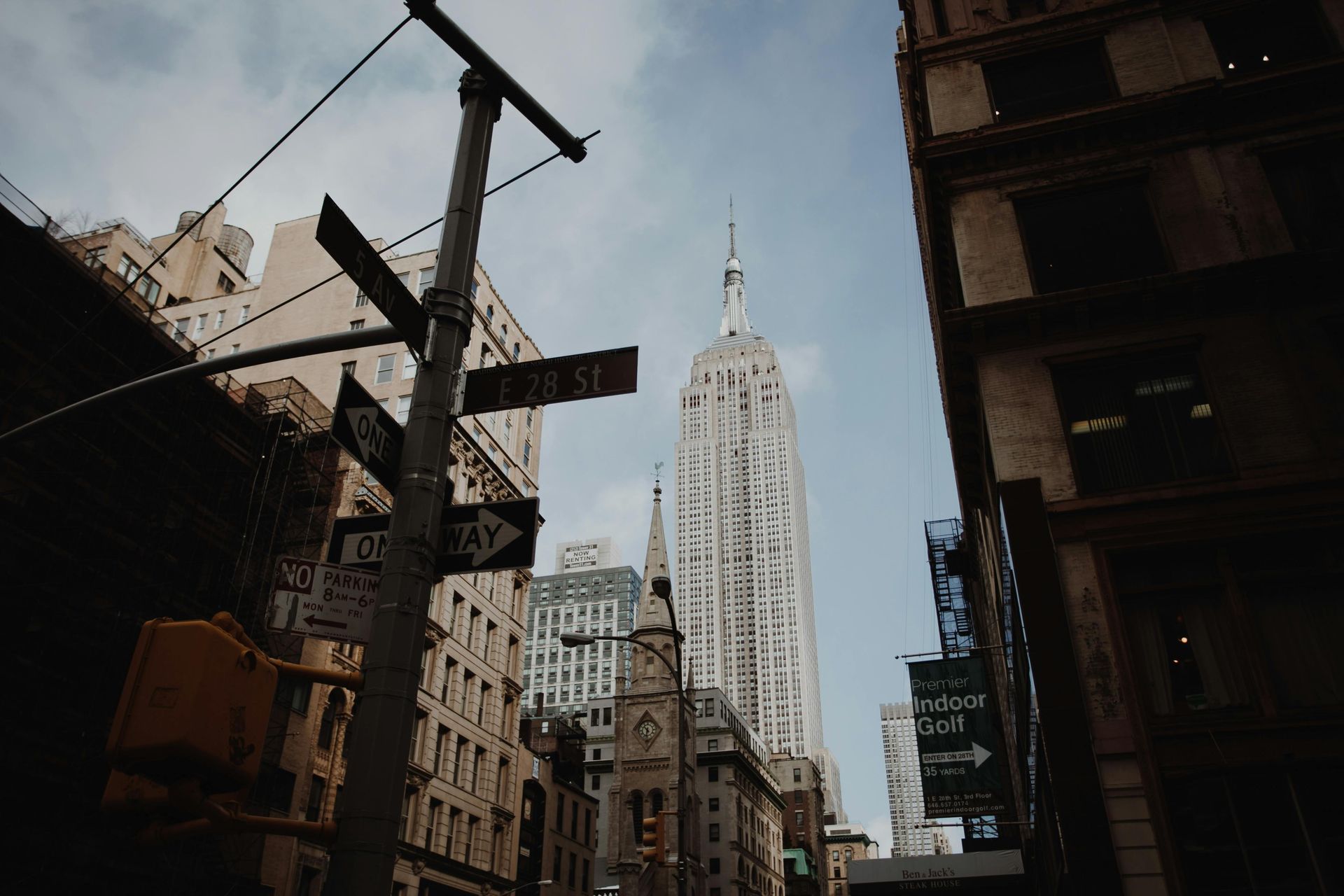 Empire State Building viewed from 28th Street in Midtown Manhattan on a clear day