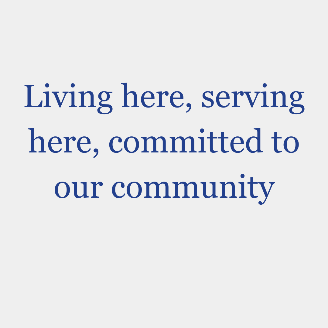 A quote that says living here , serving here , committed to our community