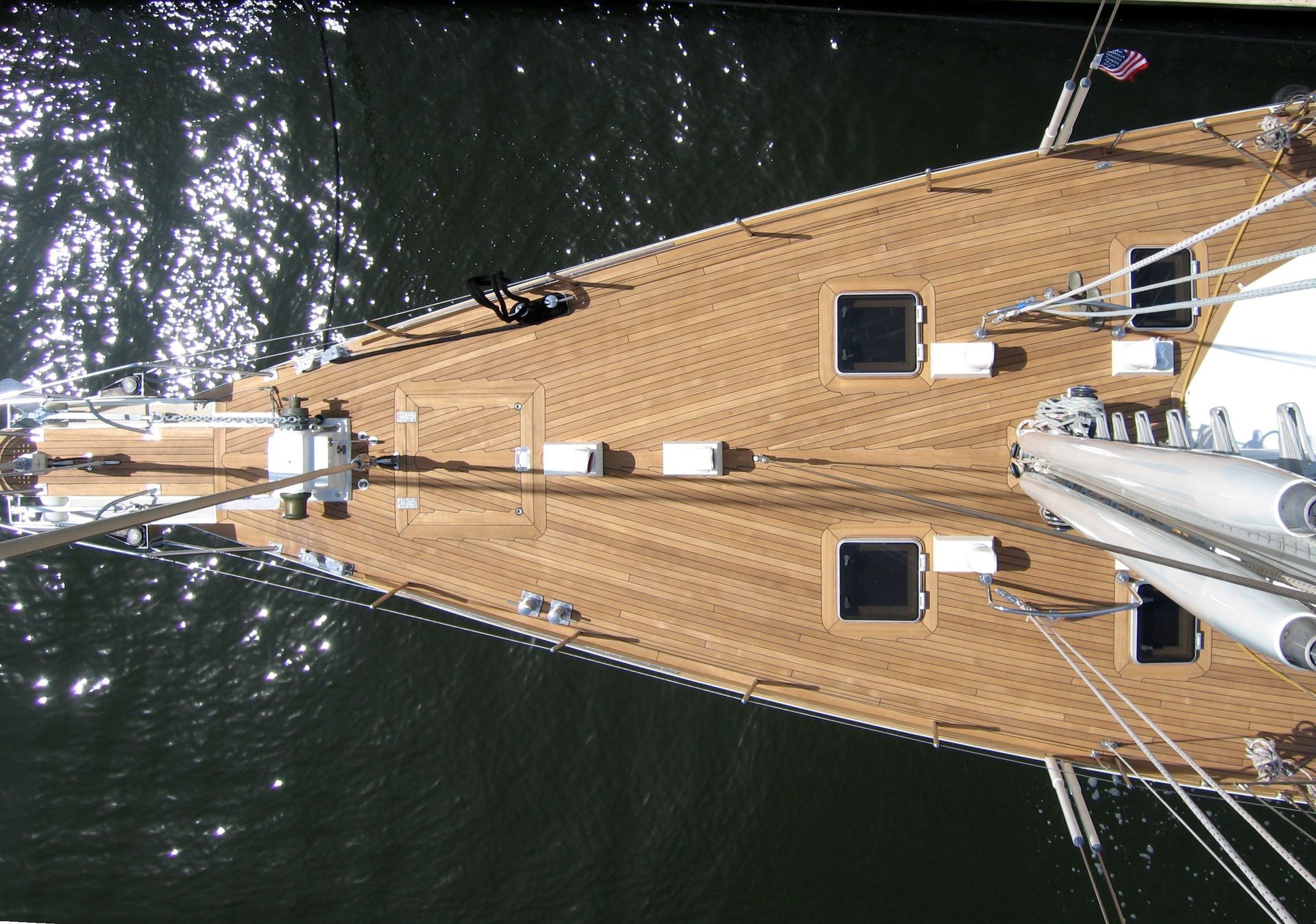 Teakdecking Systems teak decking on the bow of the Astroid, viewed from above, showcasing expert craftsmanship and design