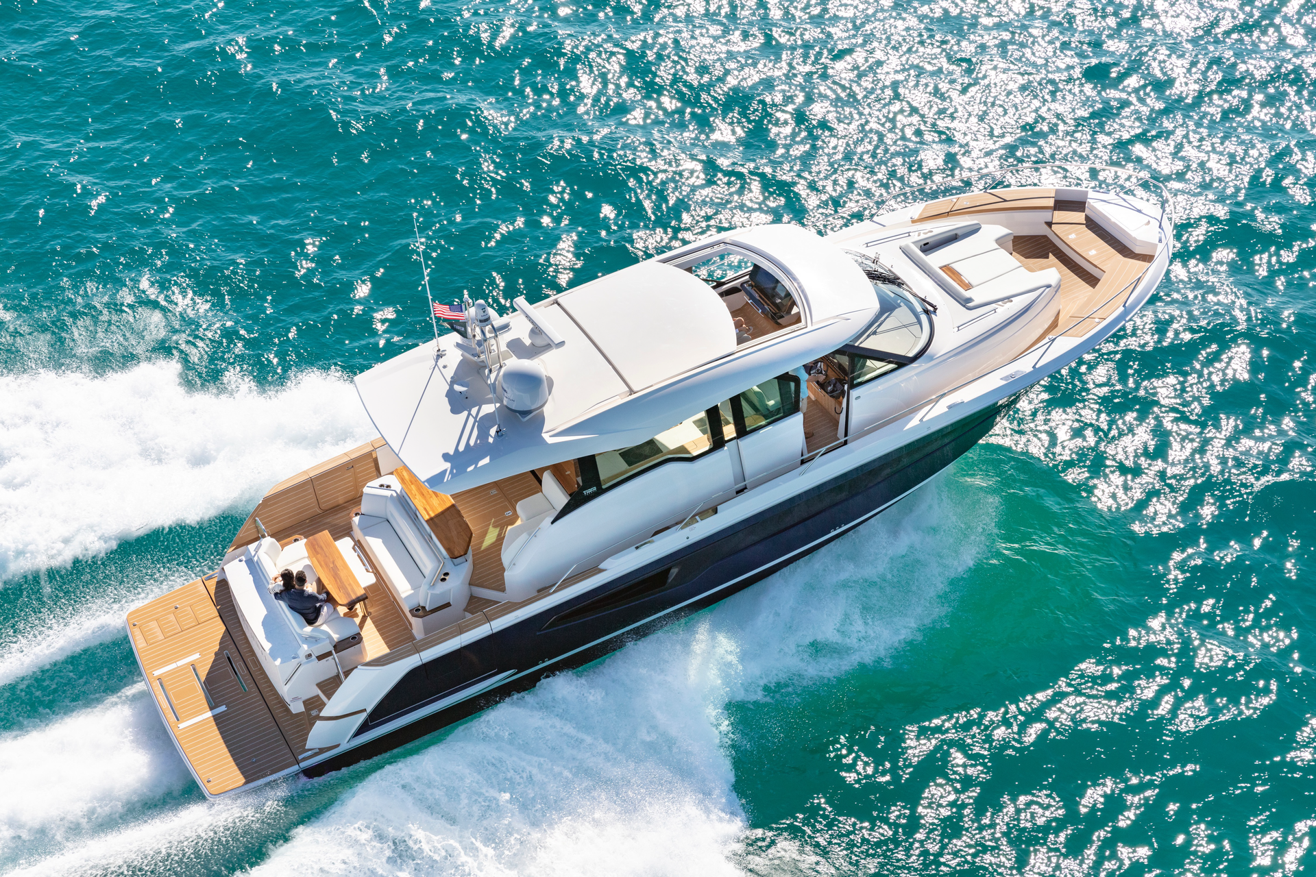 Elegant yacht gliding through the open seas, showcasing its sleek design and the beauty of maritime adventure