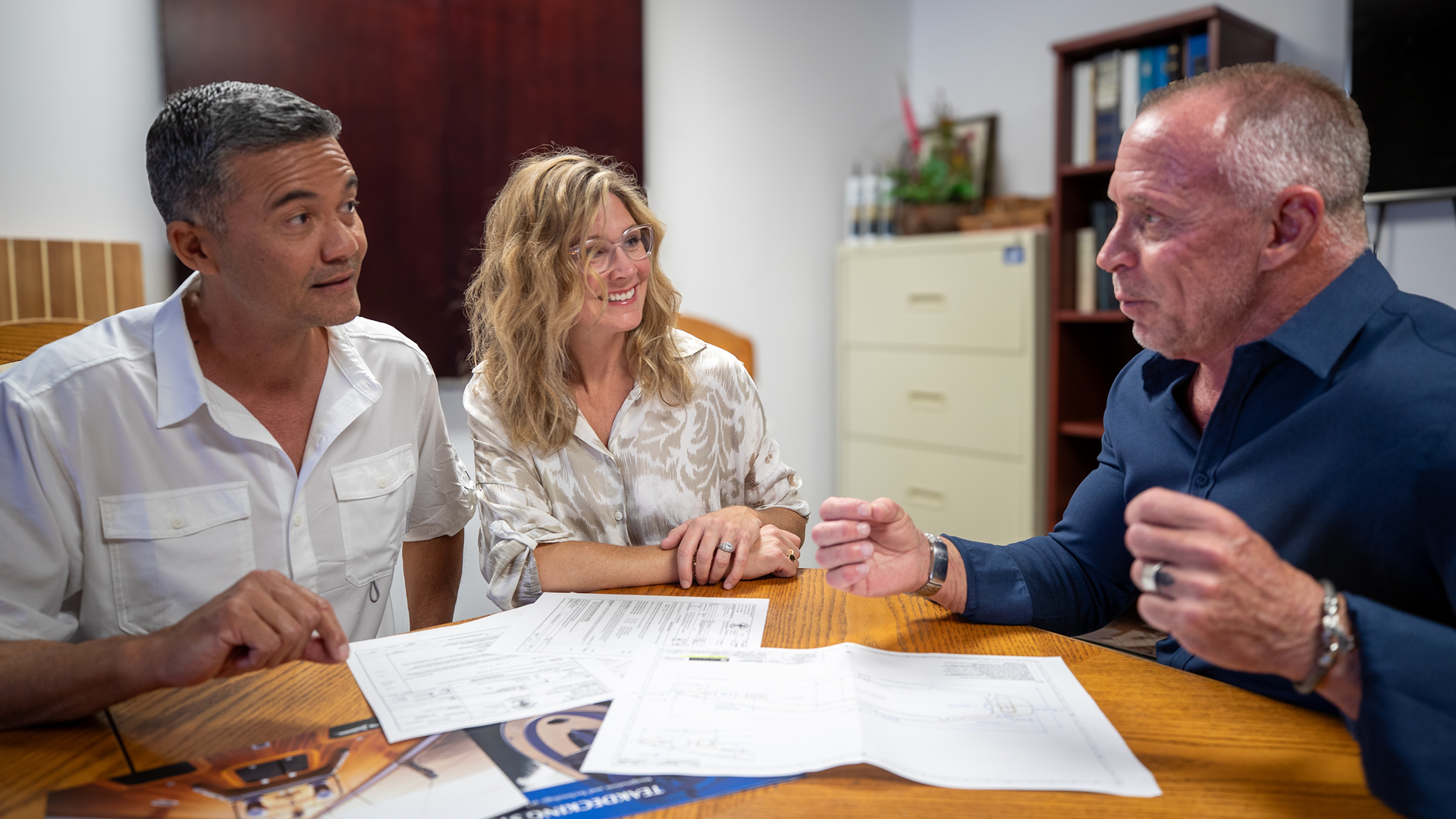 Teakdecking Systems team collaborating with customers to design the ideal teak deck for their yacht, ensuring satisfaction