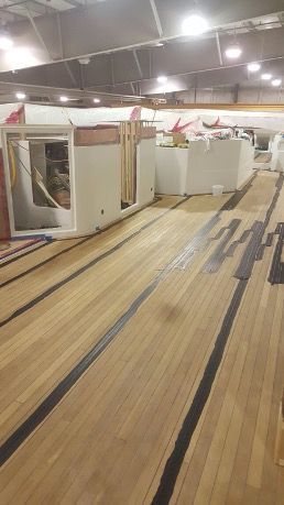 Freshly installed and caulked teak panels, highlighting expert craftsmanship in marine decking for lasting durability