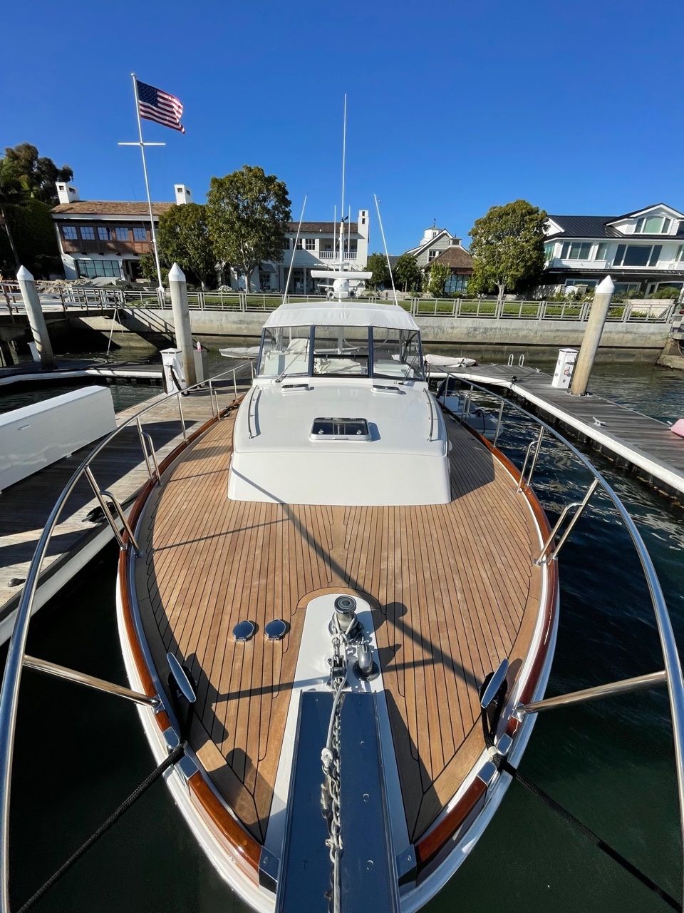 Teakdecking Systems teak decking on the bow of a boat, highlighting superior craftsmanship and marine durability