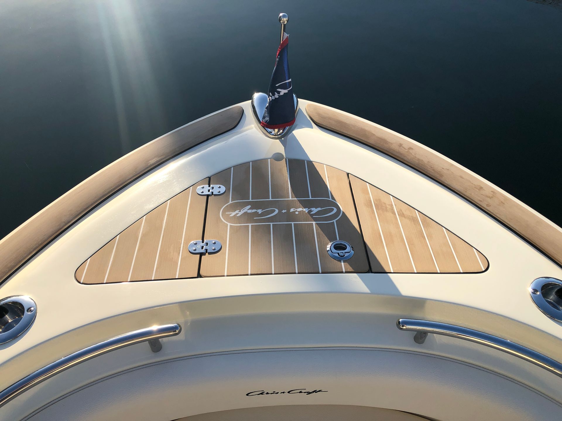 A composite deck by Teakdecking Systems on a Chris Craft boat, highlighting premium craftsmanship and design