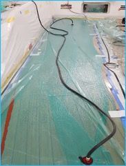 Vacuum sealing a deck ensures even adhesive distribution, preventing air pockets for a durable, high-quality finish