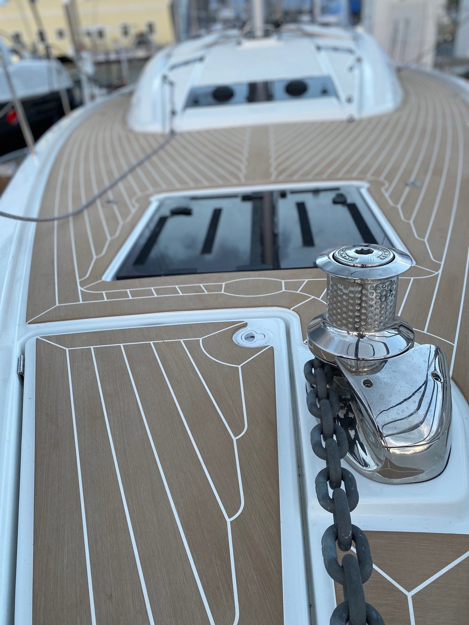 Teakdecking Systems composite decking around hatches on a sailing yacht, ensuring durability, low maintenance, and style