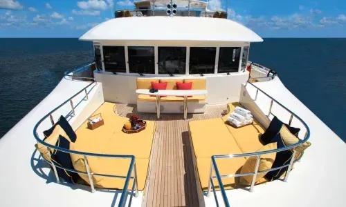 Boat bow with ample seating area, offering comfort and luxury, perfect for relaxation and enjoying the marine view