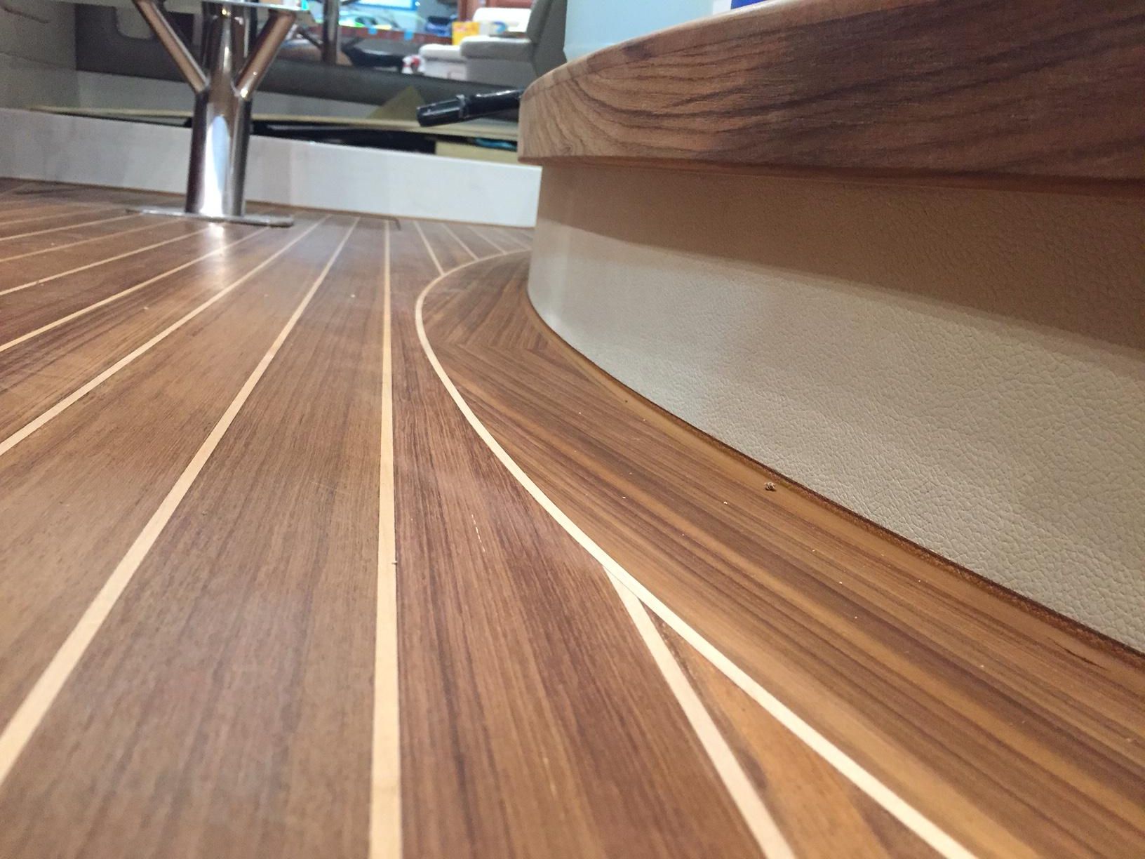 Beautiful teak deck with SIS 440 white caulking, showcasing clean lines and superior craftsmanship in marine decking