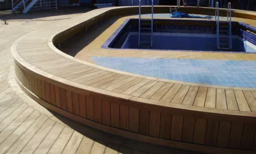 
Luxurious teak decking surrounds a sparkling pool on a yacht, blending elegance with nautical sophistication
