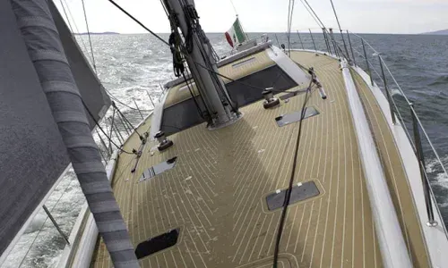 A composite deck on a sailing vessel, featuring a sleek and durable surface designed for optimal sailing performance
