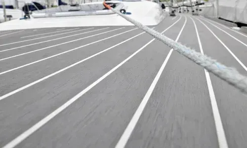 A composite deck resembling teak, combining the natural look of wood with the durability and low maintenance of composites