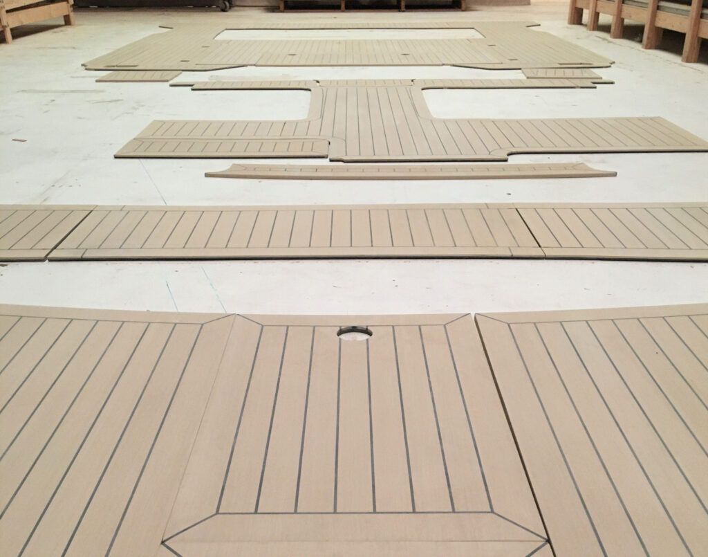 Composite decking by Teakdecking Systems laid out on the shop floor, ready for shipping to the installation site