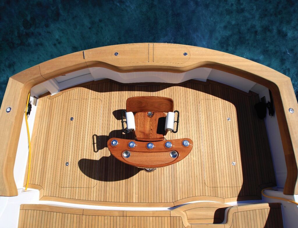 Fishing boat aft with a beautiful teak chair, combining functionality and elegance in marine craftsmanship